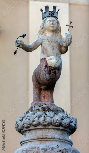 The Taormina's emblem, two-legged centaur wearing a crown and hoisting a scepter in the right hand and a globe in the left, set on top of the Baroque fountain built in 1635 in Taormina, Sicily, Italy