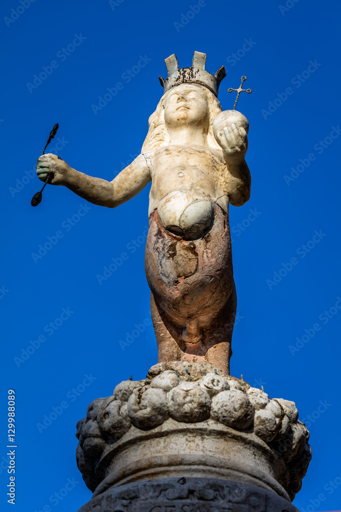 The Taormina's emblem, two-legged centaur wearing a crown and hoisting a scepter in the right hand and a globe in the left, set on top of the Baroque  fountain built in 1635 in Taormina, Sicily, Italy