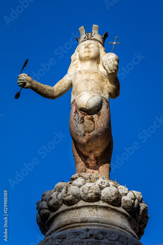 The Taormina's emblem, two-legged centaur wearing a crown and hoisting a scepter in the right hand and a globe in the left, set on top of the Baroque  fountain built in 1635 in Taormina, Sicily, Italy © V. Korostyshevskiy