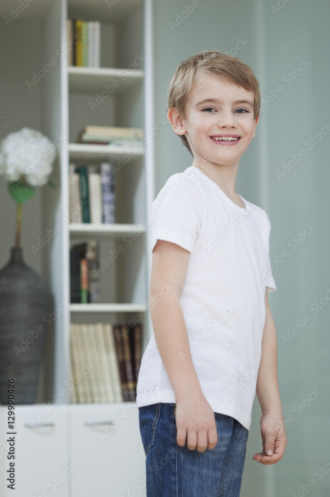 Portrait of a young boy in casuals smiling at home Portrait of a young boy in casuals smiling at home