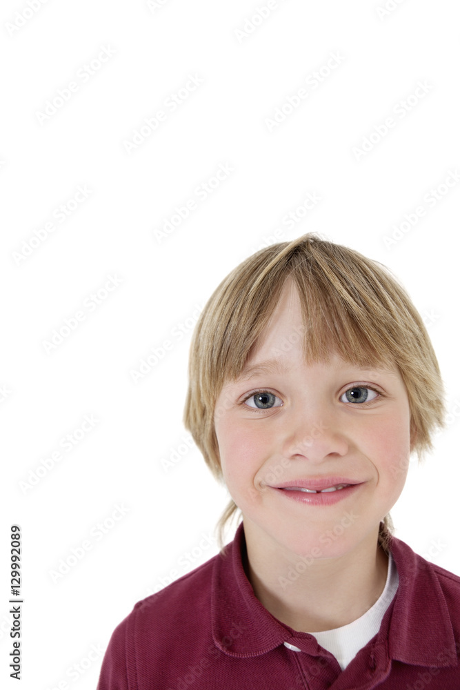Close-up portrait of a school boy over white background Close-up portrait of a school boy over white background