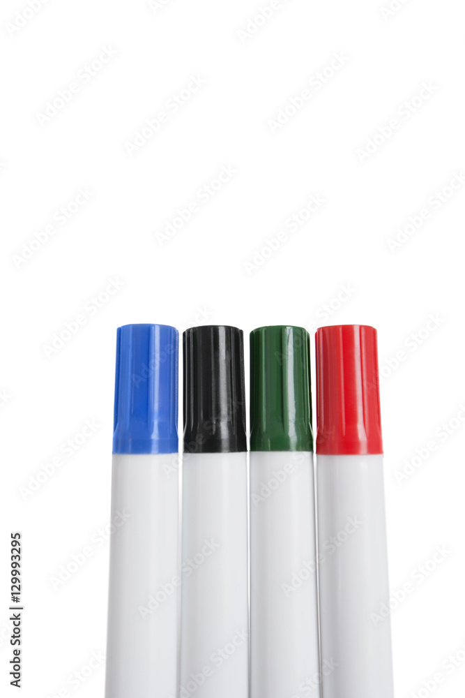 Close-up of multicolored highlighter pens over white background Close-up of multicolored highlighter pens over white background