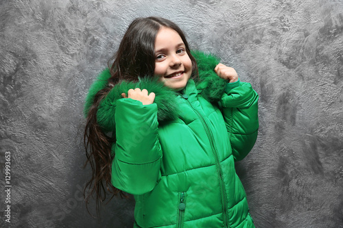 Cute little girl in warm cl...