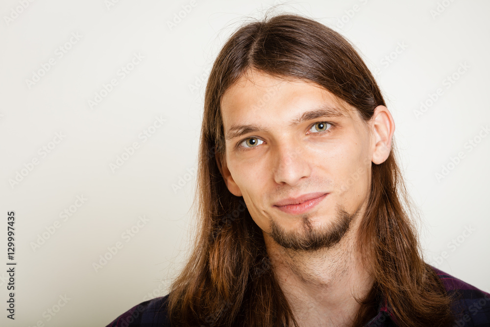 Smiling guy with long hairs. Smiling guy with long hairs.