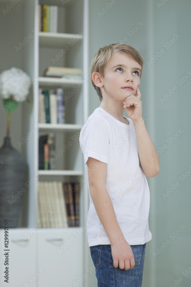 Little boy lost in thoughts at home Little boy lost in thoughts at home