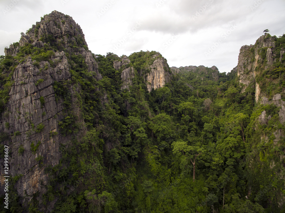Aerial view of limestone mountain Karst, the Avatar-like mountain pass of sharp cliffs, peak forest and sinkhole landscape made up of carbonate rocks, Devonian limestone