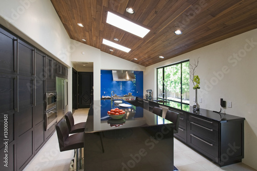 Interior of modern kitchen with breakfast bar