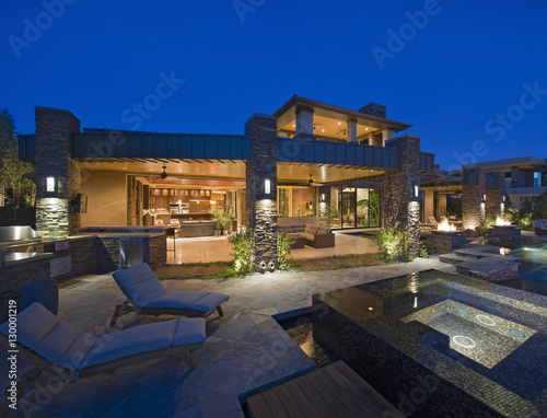 Exterior of contemporary house with plunge pool at dusk
