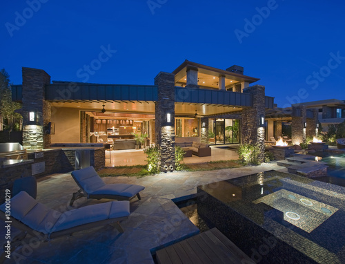 Exterior of contemporary house with plunge pool at dusk photo
