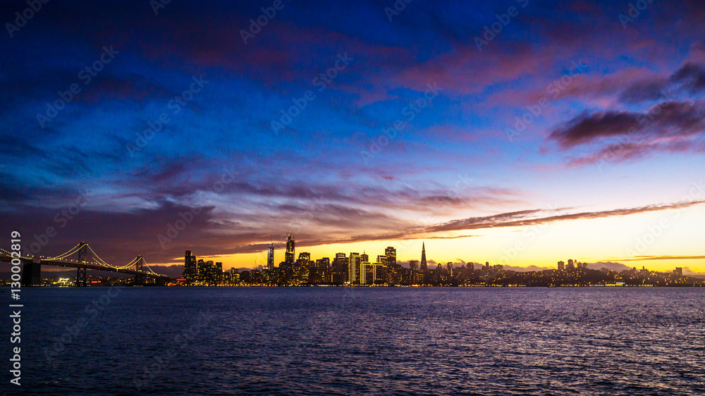 San Francisco City Lights with Dramatic Clouds at Sunset