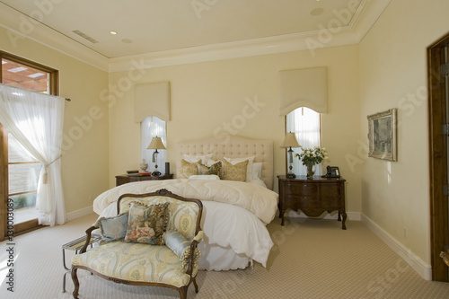 View of bedroom with side table and sofa