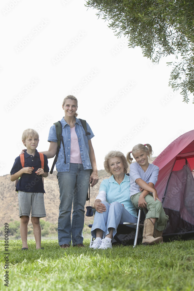 Fototapeta premium Portrait of kids with mother and grandmother on camping trip