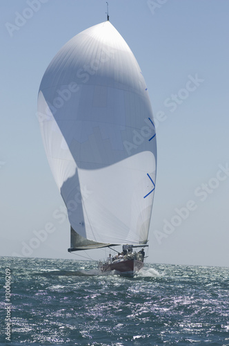 View of a yacht competing in team sailing event