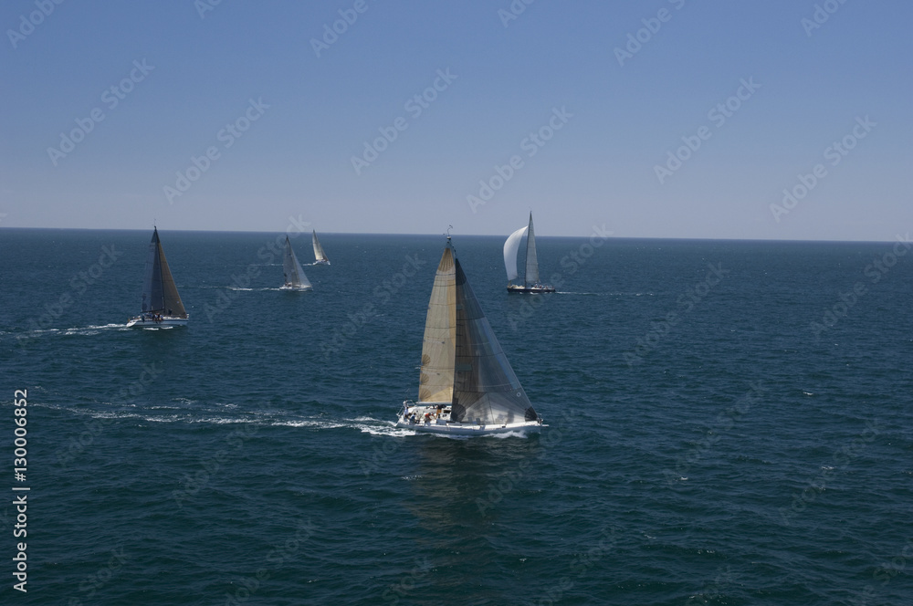 Fototapeta premium View of five yachts competing in team sailing event