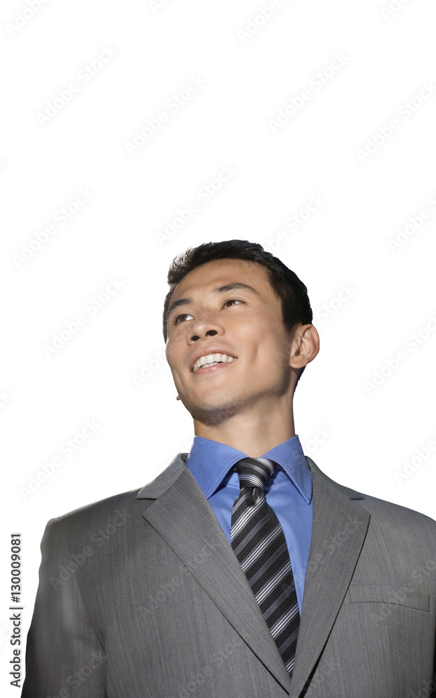 Mid-adult businessman smiling against white background Mid-adult businessman smiling against white background