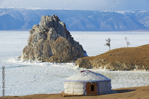 Shaman rock, Maloe More (Little Sea), frozen lake during winter, Olkhon island, Lake Baikal, Irkutsk Oblast, Siberia, Russia  photo