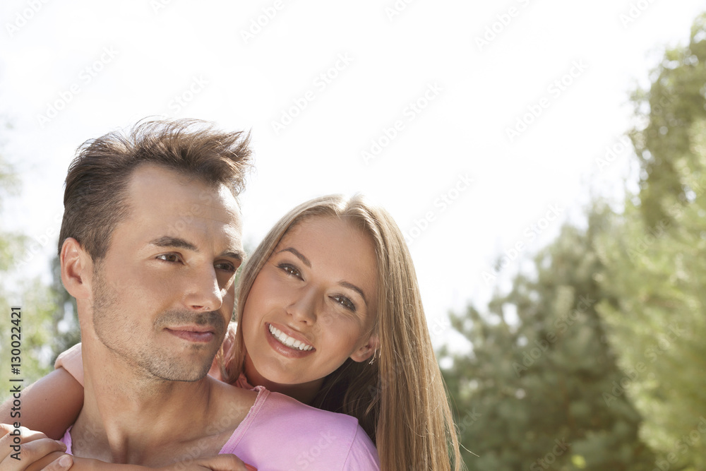 Happy young couple enjoying quality time in park Happy young couple enjoying quality time in park