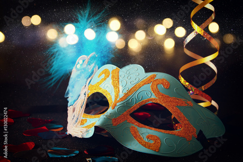 elegant venetian, mardi gras mask on glitter background