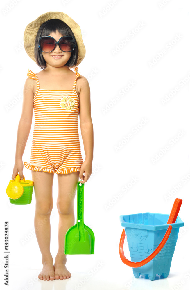 asian little girl in swimsuit with beach toys Stock Photo Adobe