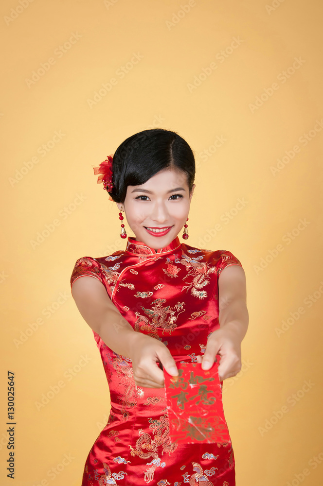 pretty chinese young woman holding red pocket for happy chinese new year pretty chinese young woman holding red pocket for happy chinese new year