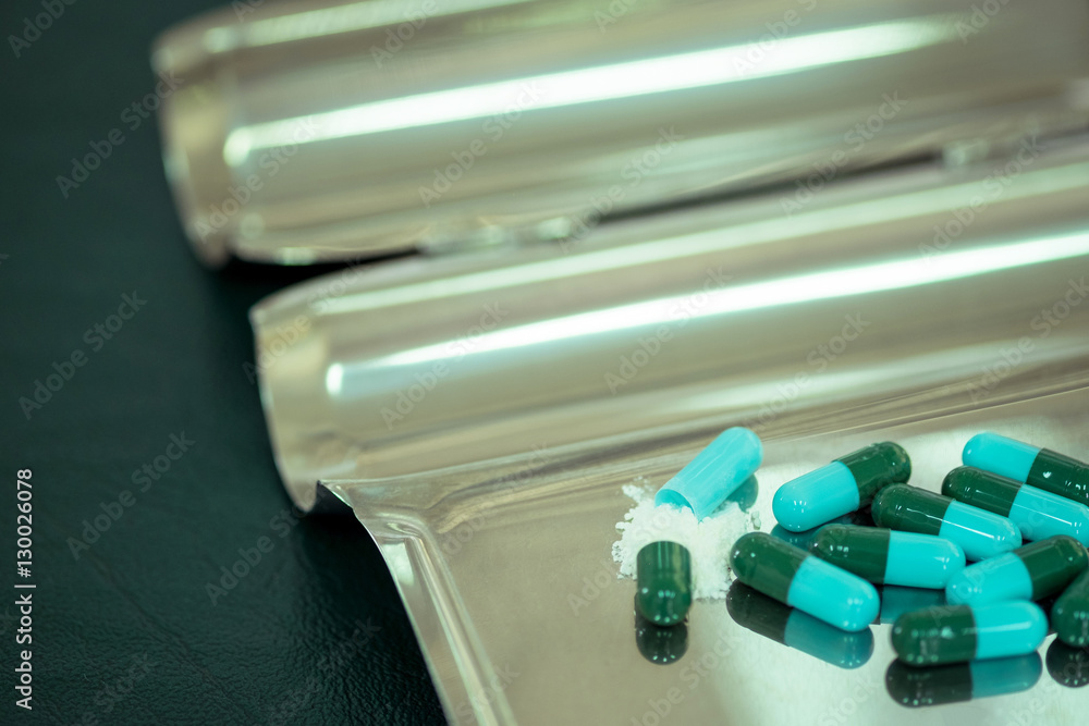 close up opened medicine capsule pill with powder close up opened medicine capsule pill with powder