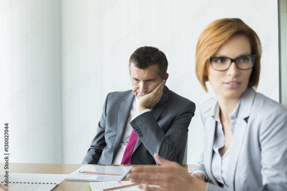 Bored businessman in conference meeting Bored businessman in conference meeting