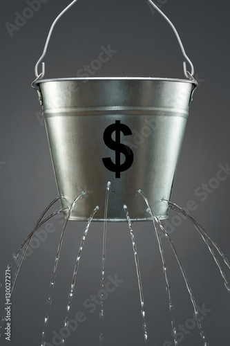 Fotografie Leaky Dollar Bucket