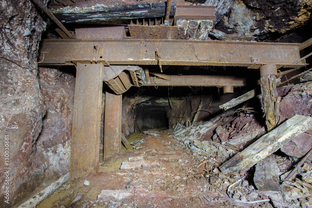 Abandoned old ore mine shaft tunnel passage metal arming Abandoned old ore mine shaft tunnel passage metal arming