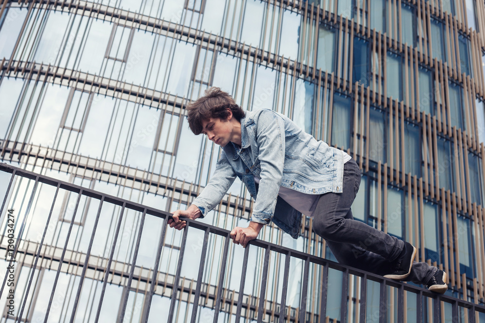 Young man doing parkour in the city Young man doing parkour in the city