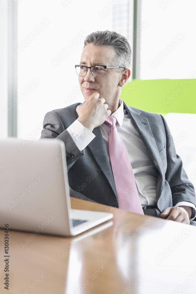 Young businesswoman using copy machine in office Young businesswoman using copy machine in office