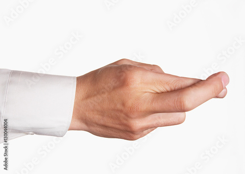 Closeup of hand with fingers crossed against white background
