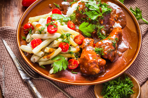 Chicken in tomato sauce with rice and green beans