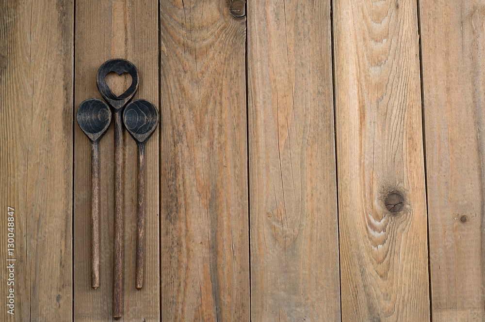 Fototapeta premium Wooden spoon on wooden background