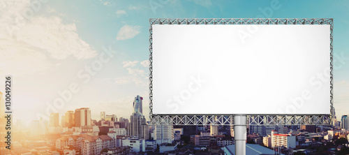 Blank billboard for advertisement at Bangkok city in sunrise photo