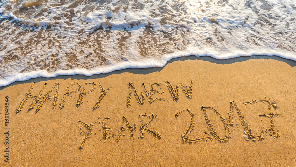 Fototapeta premium Happy New Year 2017 concept, lettering on the beach