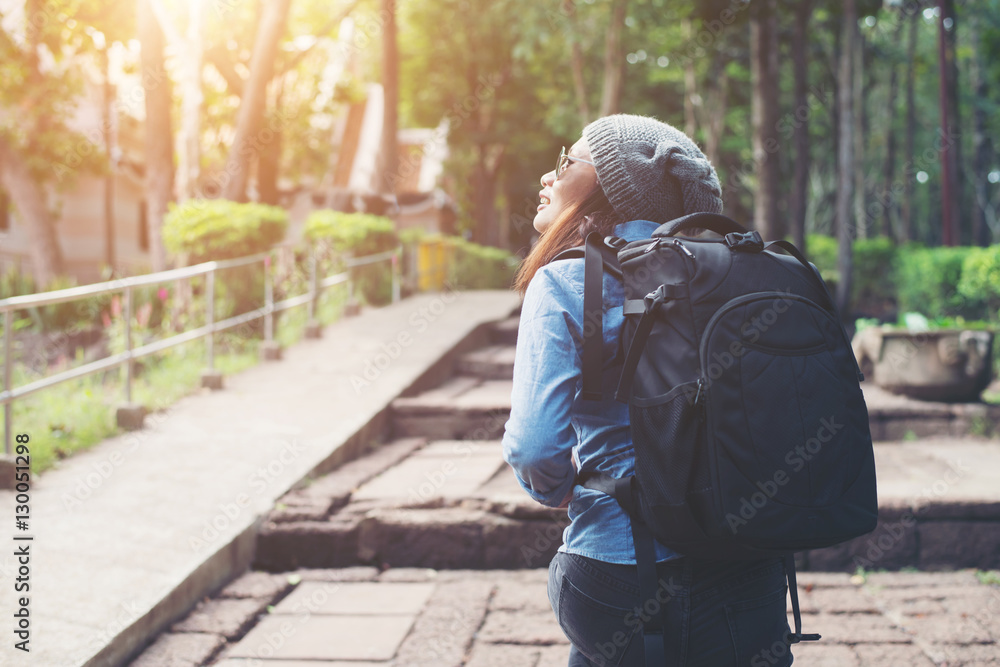 Fototapeta premium Young attractive woman tourist with backpack .