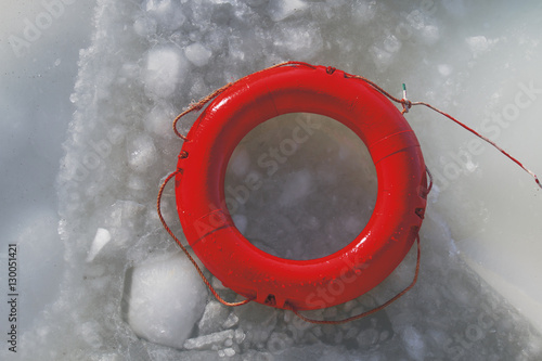 red life buoy on the frozen sea