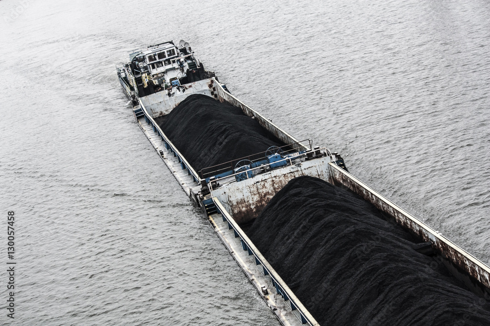 Maritime transport: barge full of coal in the Baltic sea