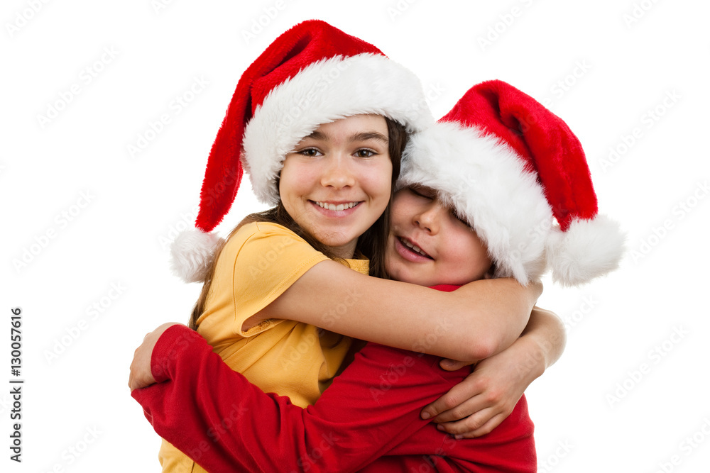 Christmas time - girl and boy with Santa Claus Hat Christmas time - girl and boy with Santa Claus Hat