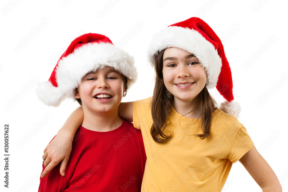 Christmas time - girl and boy with Santa Claus Hat Christmas time - girl and boy with Santa Claus Hat