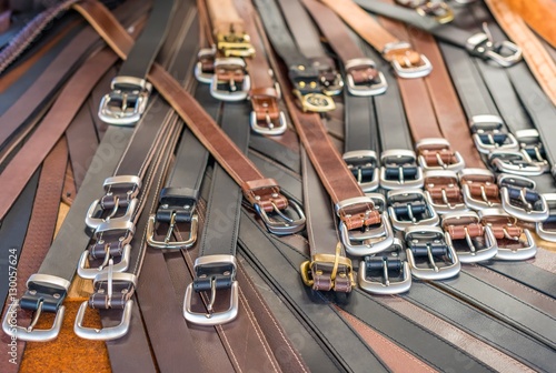 Many leather belts for sale at The Queen Victoria Market in Melb