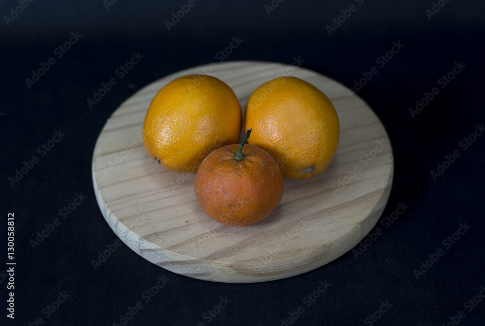 Fruit on a wooden round stand