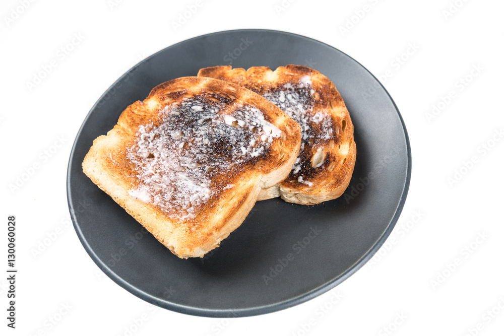 Burned whole grain toast isolated on white background