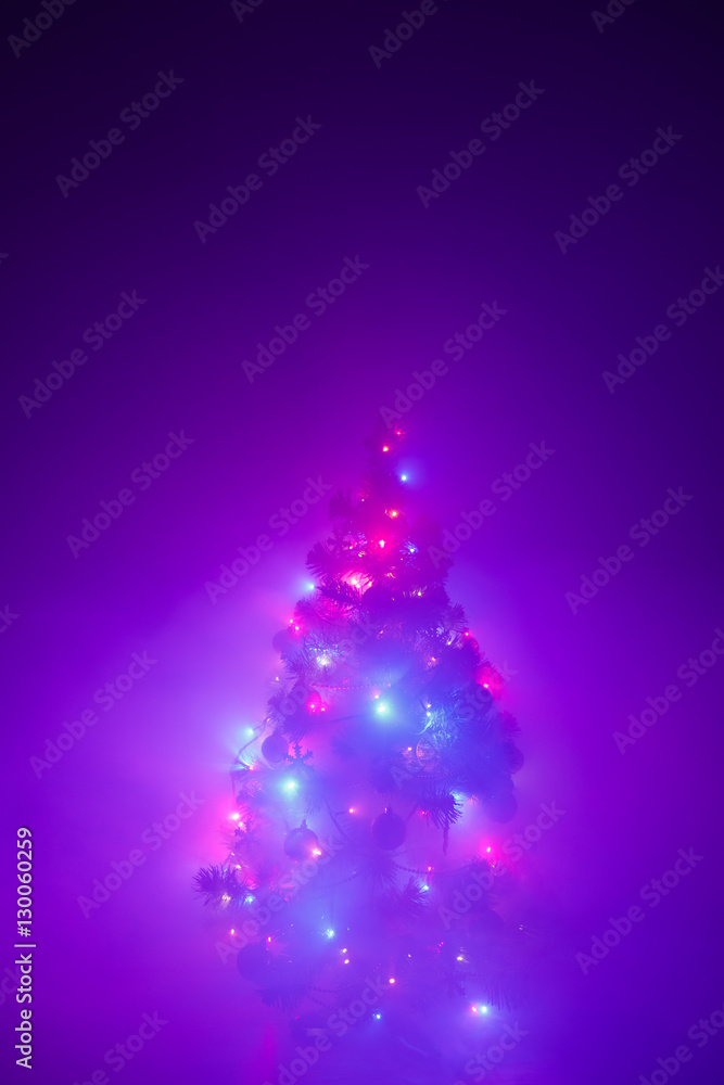 Christmas tree lights garland in frozen mist Christmas tree lights garland in frozen mist