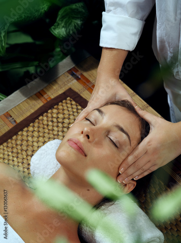 portrait of young beautiful woman in spa environment photo