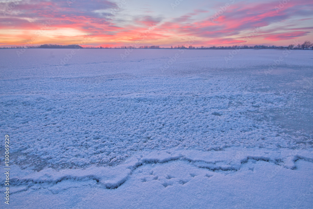 Frozen lake at sunrise