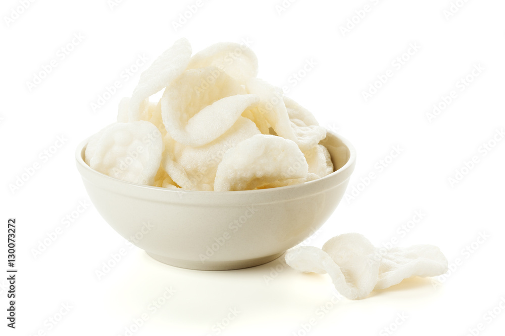Bowl of indonesian prawn crackers isolated