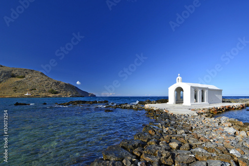 Small white church in sea near Georgioupolis town on Crete