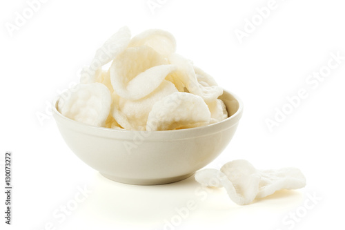 Bowl of indonesian prawn crackers isolated photo