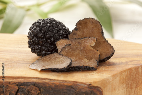 Black Chinese truffle mushrooms on chopping board
